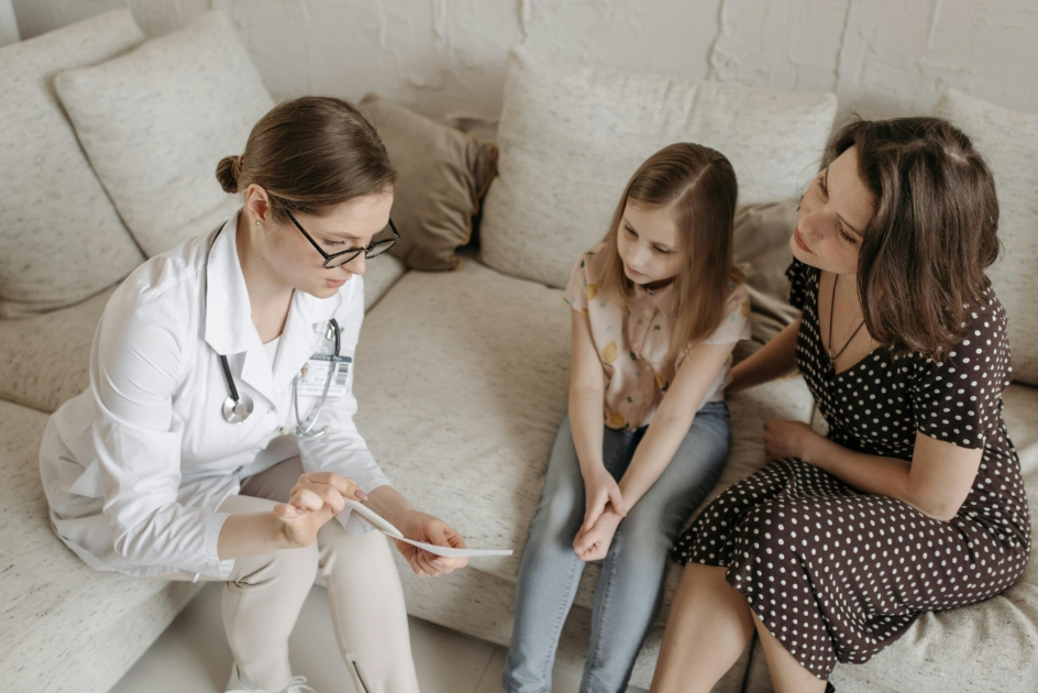 Family medicine doctor consulting with patients in a bright, modern California clinic – Woodland Clinic opportunity