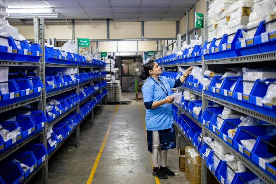 Warehouse order selector job moving pallets in a cold storage facility