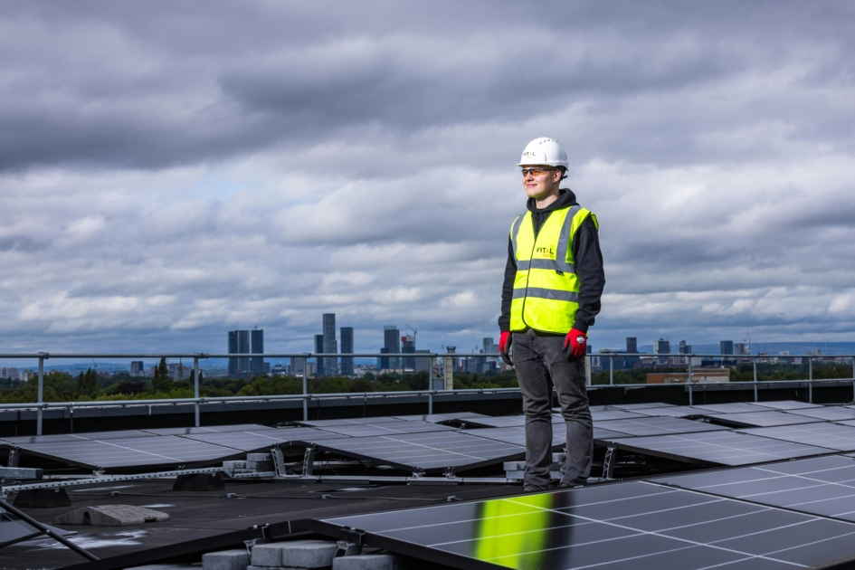 Building Automation Technician configuring a BAS panel in a commercial facility