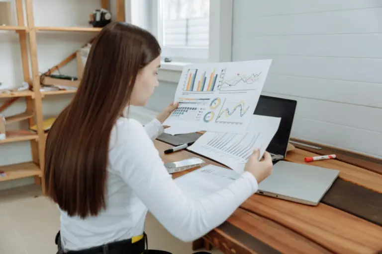 Remote Excel expert analyzing data on laptop from home