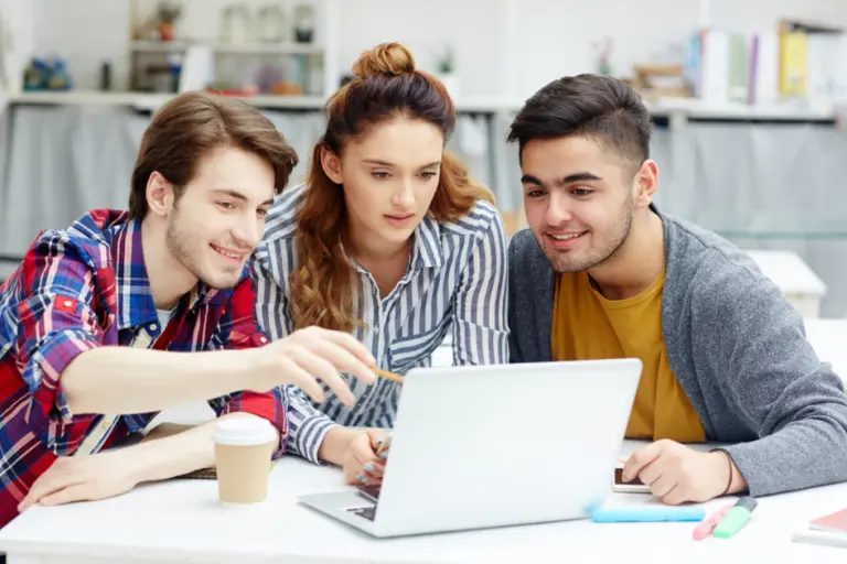 Young aspirants checking latest Sarkari Naukri 2025 job notifications on a laptop